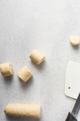 Overhead view of steamed bun dough on a white countertop, top view of mantou dough, process of making steamed milk buns
