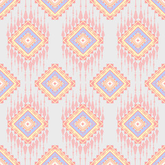 Obraz premium Pastel Geometric Diamond Pattern with Ikat Texture, Bohemian Chic Diamond Ikat Textile Design, Soft Pink and Purple Diamond Geometric Pattern, Seamless Diamond Ikat Pattern for Fabric and Wallpaper