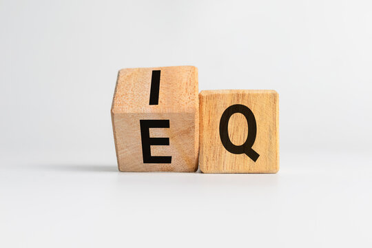 intelligence quotient and emotional quotient or iq and eq letter symbol on flip wooden cubes isolated on white background
