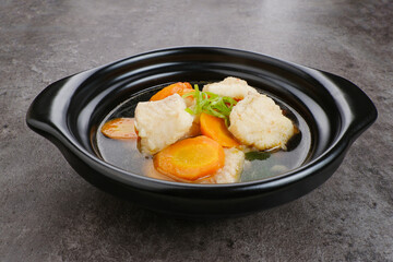 Fish soup with carrot, tomatoes and leeks. Indonesian food
