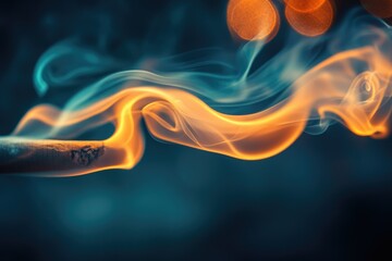 Obraz premium Abstract close-up of burning cigarette with teal and orange smoke swirling.