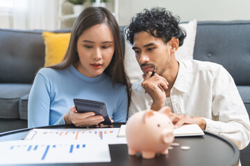 Happy asian young couple love, wife, husband calculate income and planning, saving money to buy...