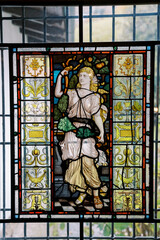 Stained glass mosaic window depicting an ancient goddess