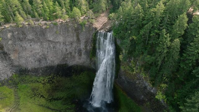 Breathtaking 4K aerial footage of Salt Creek Falls, Oregon's second-highest waterfall at 286 feet, surrounded by lush evergreen forests in Lane County. Captured in October.
