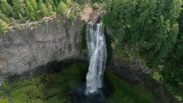 Breathtaking 4K aerial footage of Salt Creek Falls, Oregon's second-highest waterfall at 286 feet, surrounded by lush evergreen forests in Lane County. Captured in October.