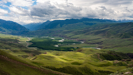 landscape with mountains and river and snow mountains.