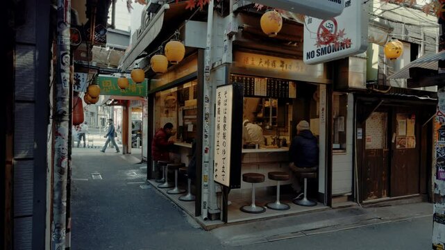 Tokyo, Japan - Feb 15, 2025 : 4K Ramen Shop in Omoide Yokocho at Tokyo's Shinjuku district.,Chef made a Ramen noodles process in Japan.