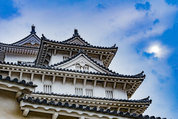 Himeji Castle in Japan under blue sky and white clouds