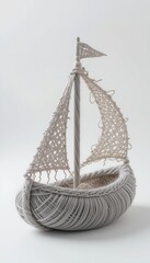Obraz premium Elegant Gray Yarn Sailboat Model Nautical Decor Craft Handmade Artwork