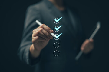 Business performance checklist concept Young business woman using laptop surveys online checklist Complete the digital form checklist via the internet...