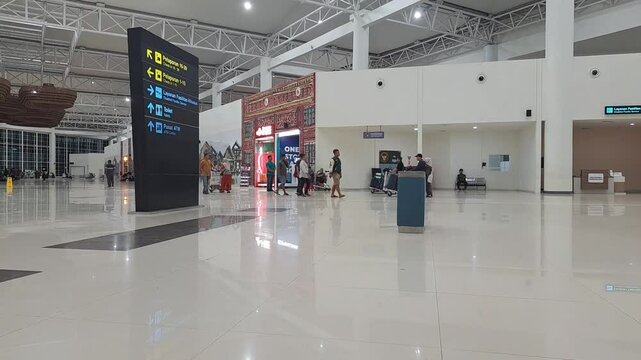 Banjarmasin,indonesia february 25th 2025 : a directional sign at an airport, providing information about gates, restrooms, baggage claim, and other facilities to help passengers navigate efficiently