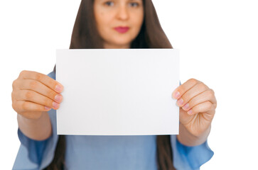 A young, attractive girl holding mockup with empty paper. A sign, an empty space for advertising, inscription, design. White background.