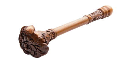 A wooden stick with a carved flower on it