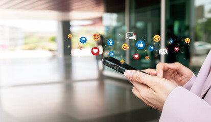 Woman holding a modern smartphone enjoying online message communication on social media network application. Technology concept.