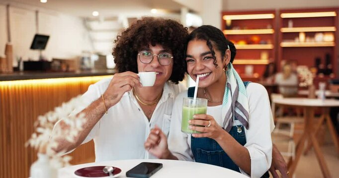 Couple, happy and face with drinks in cafe for bonding together, laughing and weekend break. Love, gen z people and support in restaurant with green smoothie, tea and holiday fun on travel adventure
