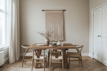 Minimalist dining room with macrame wall hanging, wooden table and chairs.