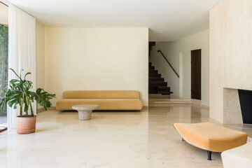 Fototapeta premium Spacious modern living room with minimalist design and elegant furnishings
