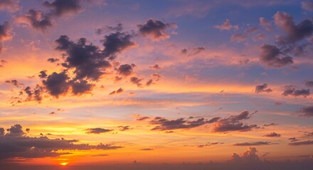 Fototapeta premium Vibrant sunset sky with scattered clouds.
