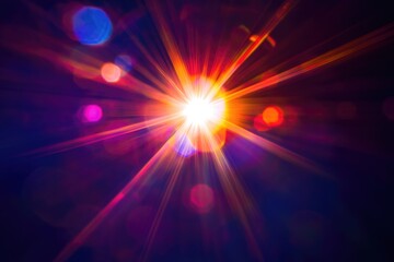 Obraz premium Vibrant light rays burst from a central point, surrounded by colorful bokeh effects creating an energetic and dynamic visual.