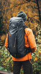 Fototapeta premium Hiker with backpack in autumn forest