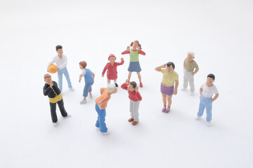Group of Miniature People Figures Representing Community