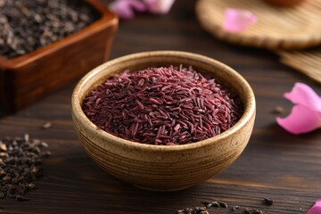 A bowl of rich purple rice grains. Perfect for healthy food blogs and articles about nutrition.