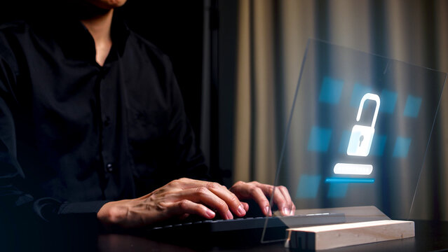 A pair of hands on a keyboard, with binary code and programming language overlayed on top. A red graphic of a closed padlock sits centered, indicating data security of cyber and data protection.