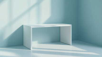 Minimalist white desk in a blue room with sunlight patterns