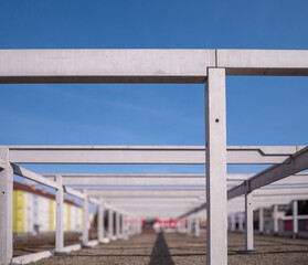 Concrete structure of the shopping center under construction. Concrete pillars are the basic...