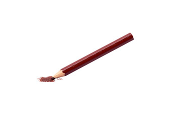 Brown colored pencil on a light orange surface