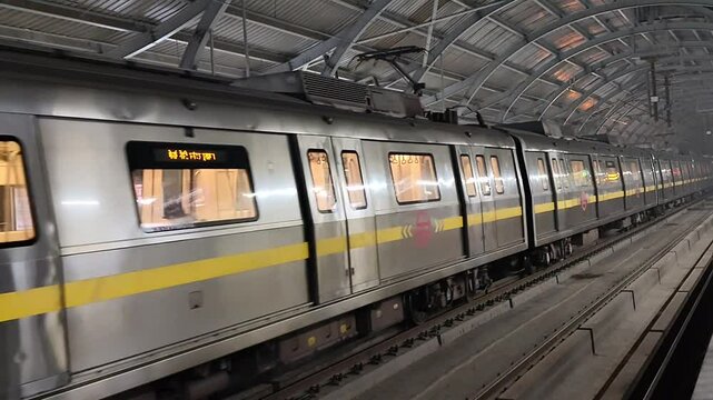 New Delhi, India, August 12 2024 - Delhi Metro train arriving at Jhandewalan metro station in New Delhi, India, Asia, Public Metro departing from Jhandewalan station