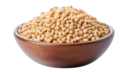 Wooden bowl overflowing with crunchy wheat bran nuggets on transparent background