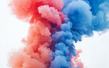 Fototapeta premium Colorful smoke clouds swirl in vibrant pink and blue tones creating an artistic atmosphere at a celebration or event