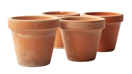 Four empty terracotta flower pots isolated on transparent background