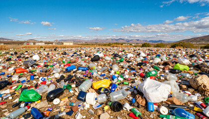 Cluttered landscape of discarded plastic waste at urban outskirts, environmental concern