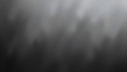 A textured abstract background featuring a blend of black and gray speckles, creating a sense of depth and unevenness, resembling a misty or foggy atmosphere.