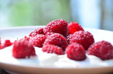 Raspberry. Sweet red raspberries. Juicy raspberries on the table. Fresh Raspberries. Rubus idaeus. Sweet healthy dessert. Fruit dessert.