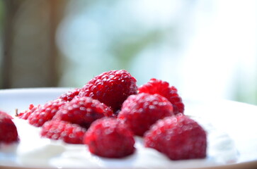 Raspberry. Sweet red raspberries. Juicy raspberries on the table. Fresh Raspberries. Rubus idaeus. Sweet healthy dessert. Fruit dessert.