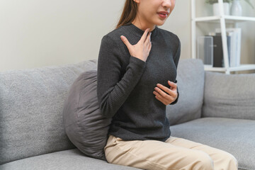 Women feeling pain in her chest from reflux acid