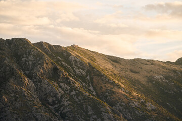 Misty mountain landscape with lush vegetation and bay