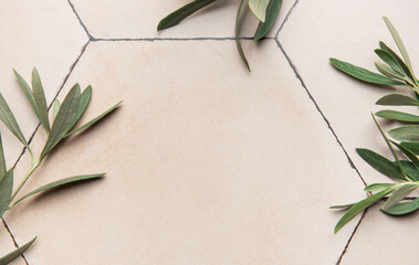Olive branches framing hexagonal tiles background, rustic elegance