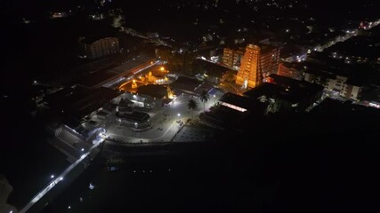 Aerial view of Dehradun city in India during a stunning orange sunset, showcasing rows of residential houses in Dehradun, Uttarakhand. A beautiful city in India, captured in the evening.