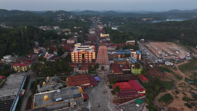 Aerial view of Sringeri Sharada Temple, located in the Chikkamagaluru district of Karnataka, India, alongside the serene Tunga River at sunset.