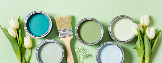 Art banner with open paint cans in spring gamma with green shades, brush and white tulips. Perfect concept for home renovation, repair, interior design, color trends and creative DIY painting projects