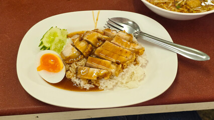 Crispy pork with rice, egg, and sauce