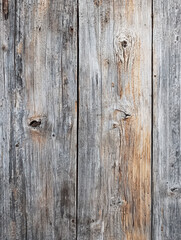 Naklejka premium Rustic Wood Texture: A detailed close-up of weathered wooden planks, showcasing the natural grain, knots, and textures of the aged wood, offering a tactile and visually appealing surface.