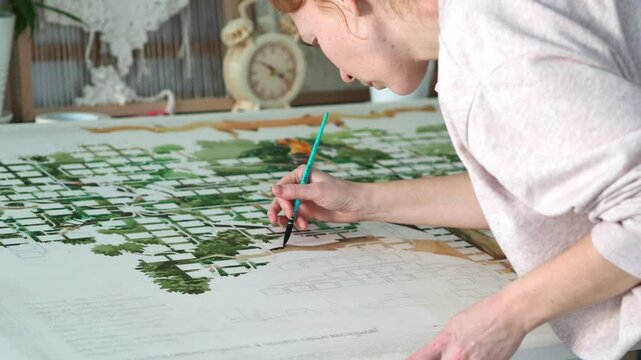 Art painting. Visual art. Hobby inspiration. Girl Artist creates a graphic picture, Family tree, using watercolors and ink. Brush in hand draws. Green color. Illustrator.