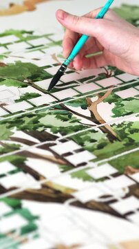Art painting. Visual art. Hobby inspiration. The artist creates a graphic picture, Family tree, using watercolors and ink. Brush in hand draws. Green color. Illustrator.