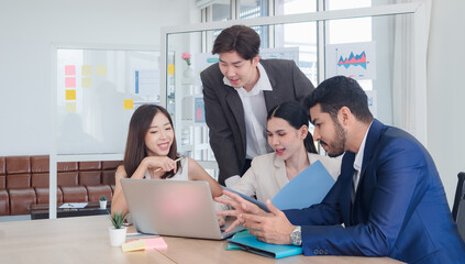 Business manager employee team woman and man asian group meeting presentation look holding document and computer labtop talk project creative plan ready for happy work marketing sale in room office