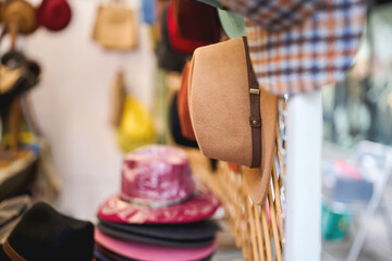 Stylish hats displayed for sale at an outdoor flea market